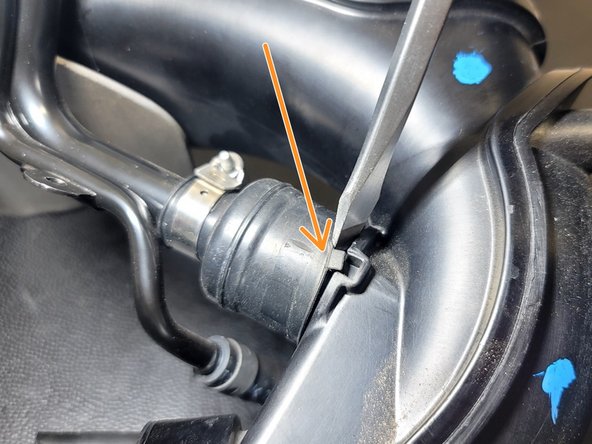 Place screwdriver as shown. Twist and pry while working around the perimeter to break seal and back rubber off the TIP a bit