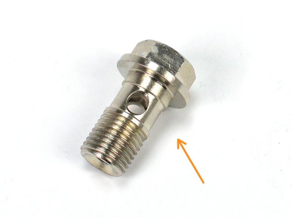 Locate the provided Lower Coolant Pipe, M12 Banjo Bolt, and two (2) M12 Copper Crush Washers