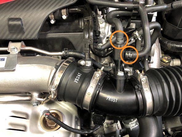 Use needle nose pliers to loosen both OEM spring clamps and slide them up the hoses