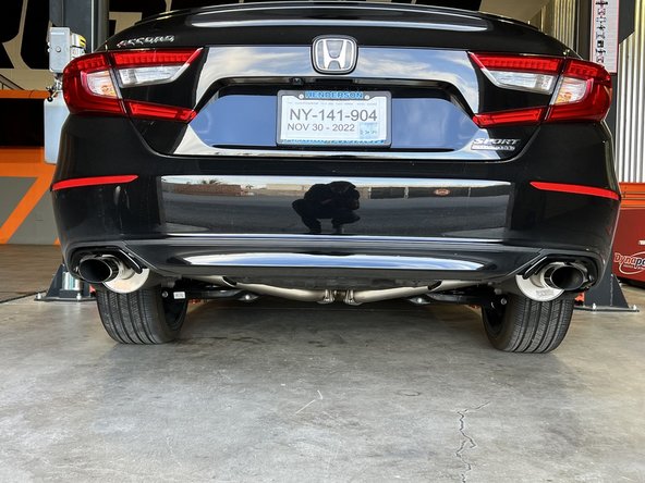 Stand back from the car and verify that the tips are centered and have at least 1/3 inch clearance from the shrouds on both sides