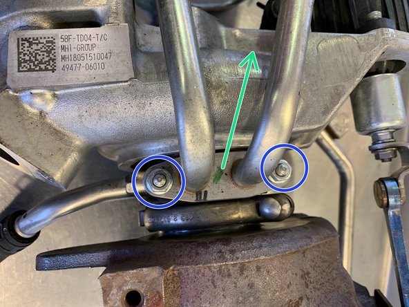 Remove the (2) 10mm nuts for the hard water lines and set them aside