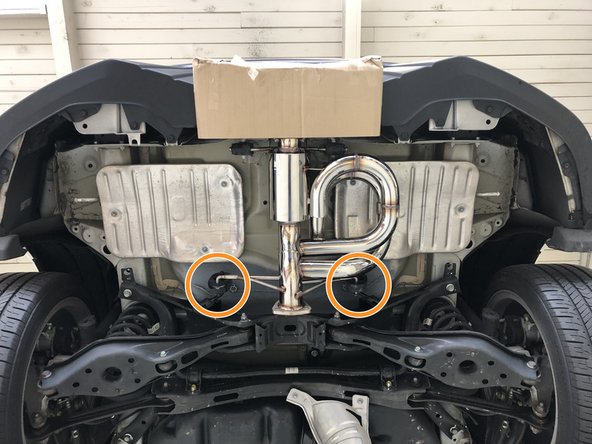 Insert both forward hangers as shown