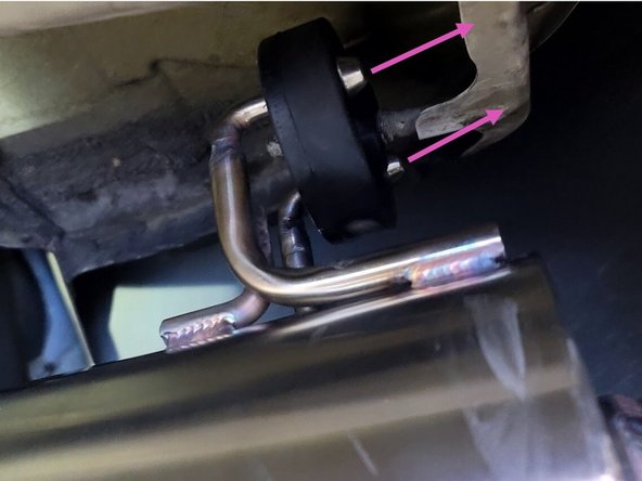 Using a spray cleaner, lubricate the hanger support for the muffler section