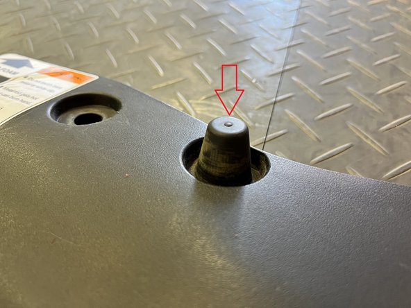 Using your fingers to press down hard on the rubber stop until it pushes out from the other side. Repeat this step for the other rubber stop