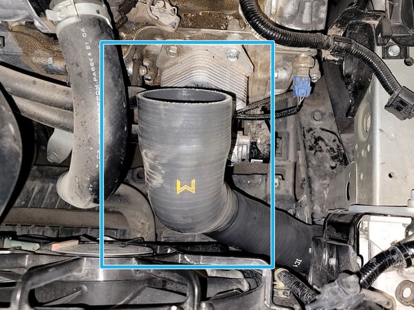 Place the FMIC outlet silicone. Slide outlet silicone on end tank. Make sure the FMIC end hits the bump stop on the end tank. Rotate it so the cold pipe end rests close to the coolant hose as shown