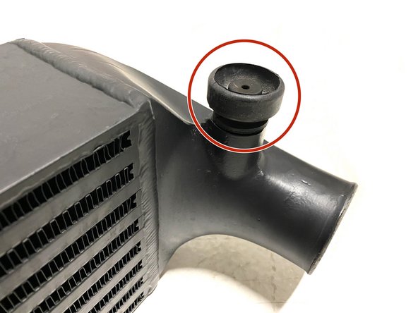 Install the rubber mounts onto the bottom mounting pegs of the 27WON intercooler as shown