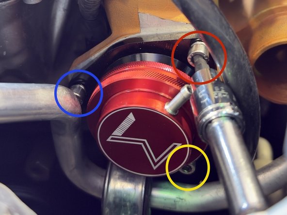 Using a 5mm ball end hex socket and 3” extension, guide the first fastener through the BPV mounting hole and thread onto Turbo Inlet Pipe. Leave finger tight