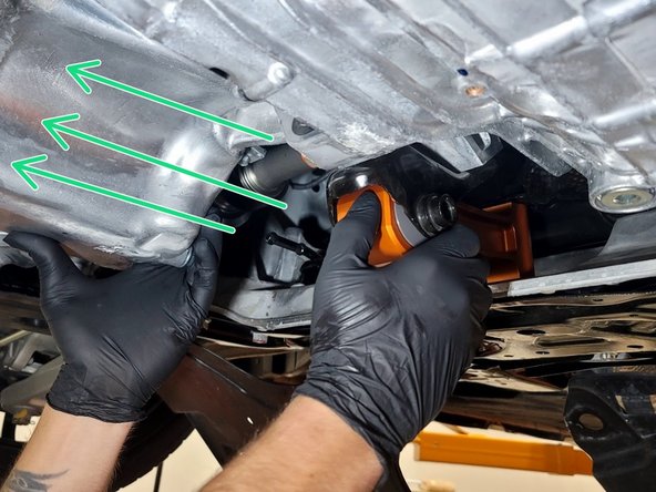 Gently slide the rear end of 27WON RMM into the bracket as shown