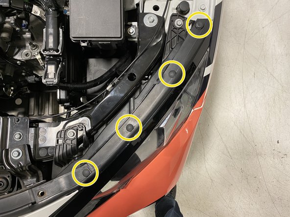 Remove the upper radiator panel from the vehicle