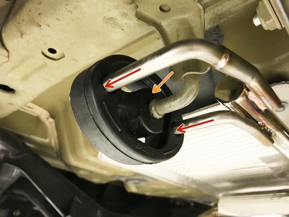 Then raise the rear end of the muffler section up and insert both rearward hangers