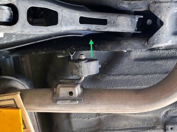 Using a spray cleaner, lubricate the remaining rear hanger and rubber support