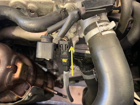 Reconnect the lower oxygen sensor electrical pigtail as shown