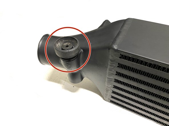 Install the rubber mounts onto the bottom mounting pegs of the 27WON intercooler as shown