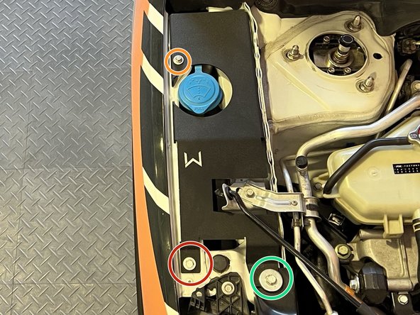 Place passenger side shroud as shown