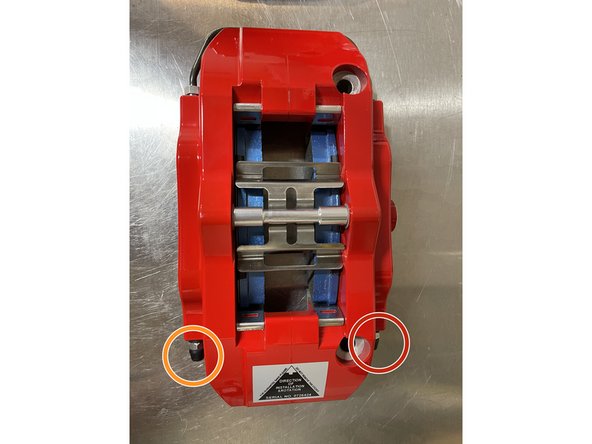 Tools - You will need a fresh container of Dot 3 Brake Fluid, bleeder bottle and hose as shown (the hose should fit tight on the bleeder screw), 10mm box-end wrench, and a friend to help with the process