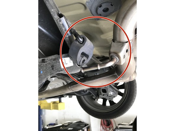 Pull the single rod hanger completely off the hanger rod and pivot out of the way as shown