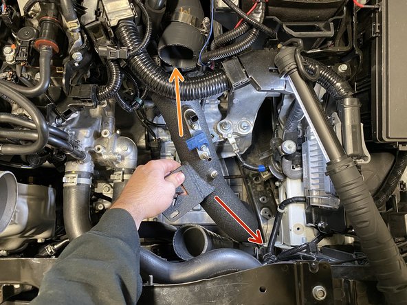 Place the curved end of the 27WON cold pipe into the open space in the engine bay