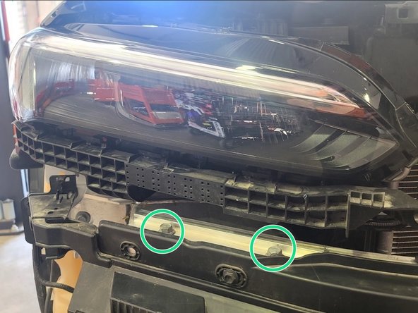 Remove four (4) bolts using 14mm socket and ratchet, two from each side