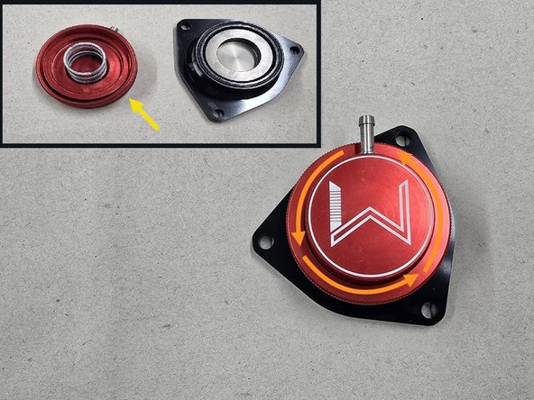 Twist the knurled ring on the BPV counter clockwise to loosen the BPV cap as shown