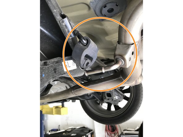 Pull the single rod hanger completely off the hanger rod and pivot out of the way as shown