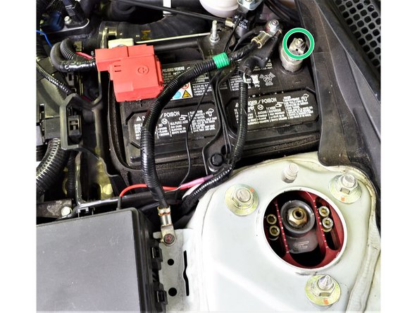 Remove the OEM ground battery cable (blue circles) by unbolting the 10mm bolt and nut (blue circles) with a wrench or 10mm socket and ratchet