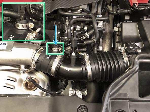 Tighten the clamps securing the intake tube using a 5.5mm socket and ratchet