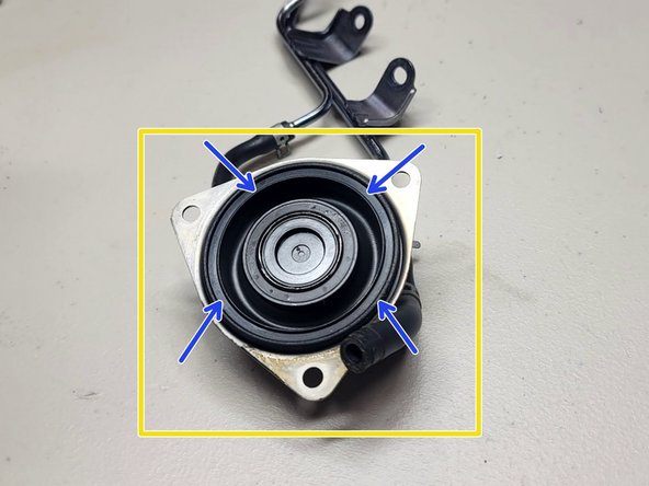 Slide clamp (blue arrow) using pliers up rubber hose