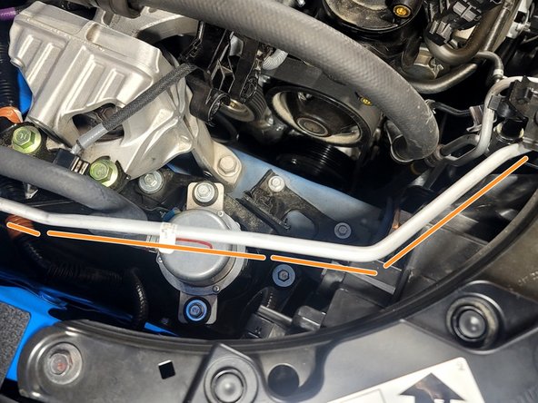 Use caution not to bend or damage A/C line while removing TIP