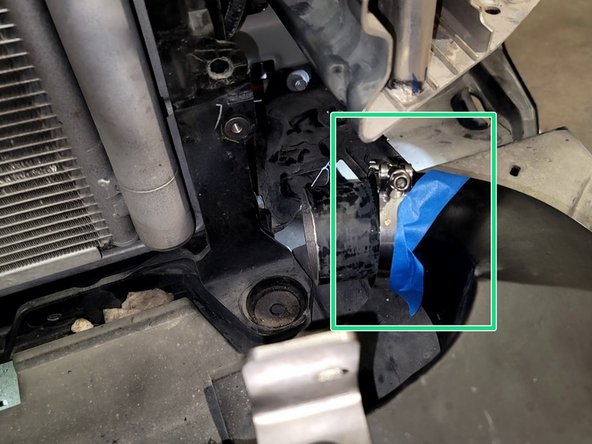 Take the nut off one of the provided 67-75mm hose clamps. Thread it back on to two threads