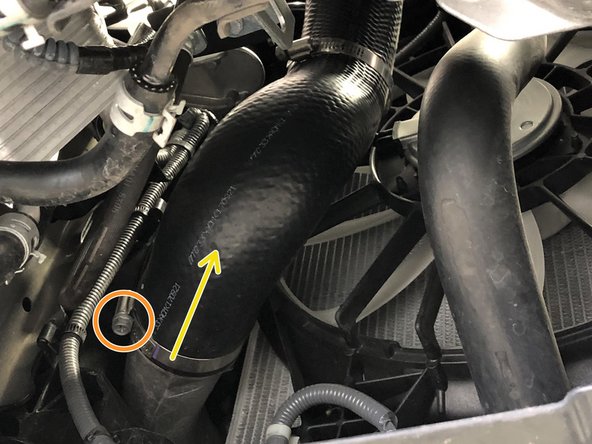 Loosen the clamp that connects the OEM cold side boost tube to the intercooler using a 10mm socket and ratchet