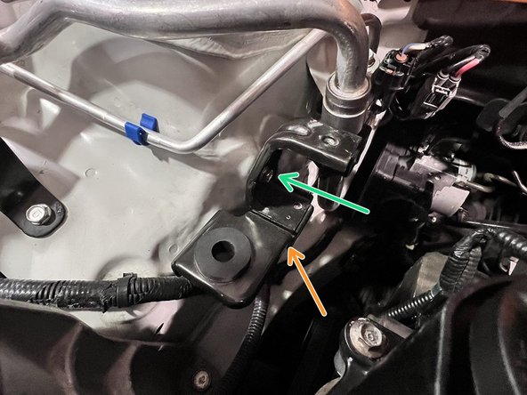 Use a 3/8&quot; ratchet and 10mm socket to remove (2) 10mm bolts securing the lower chassis tank bracket