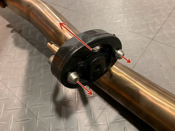 Use tongue &amp; groove pliers to press the rod out of the rubber hanger, remove the rubber support off the OE exhaust hangers as shown