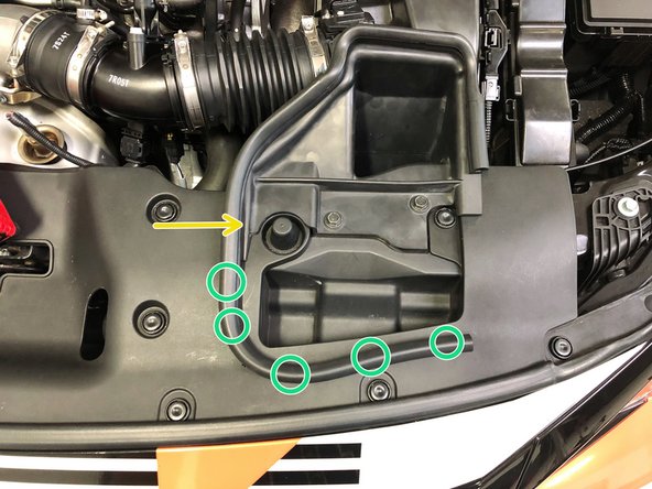 Reinstall the rubber tab in the corner of the OEM air duct onto the upper radiator panel