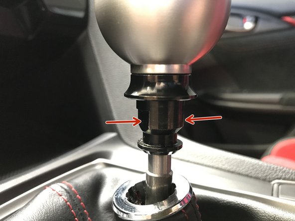 Locate the two flat spots on the OEM locking nut