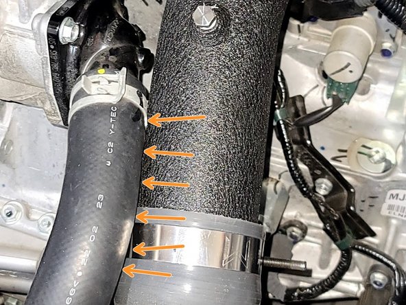 Push cold pipe into position by checking gap near coolant hose as shown. There should be about a 3mm or 1/8 inch gap