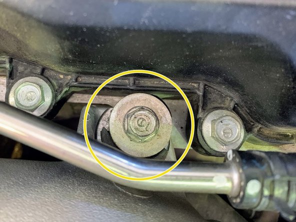 Reinstall the (2) OE 10mm bolts to mount the bottom hard line to the intake pipe