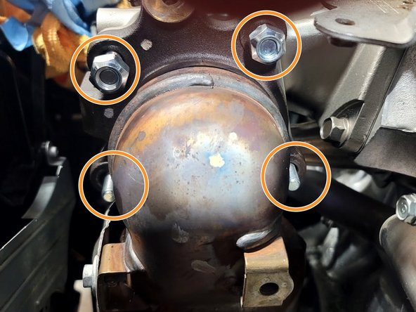 Attach the downpipe to the turbo using a 17mm socket and ratchet on the four (4) provided M10 crimp nuts. Torque to 42-48 ft-lbs