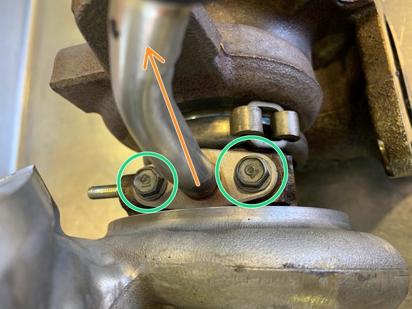 Remove the (2) 10mm bolts for the oil return hard pipe