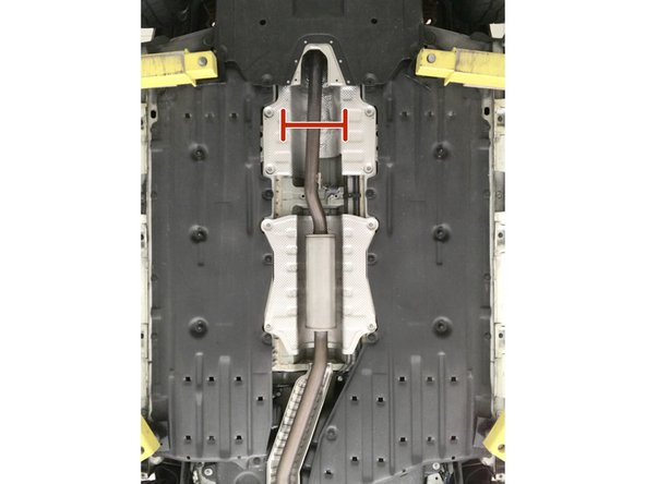 Support the exhaust mid-section with a jack stand, bungy, or second set of hands  before the next step