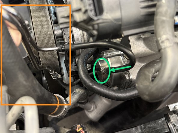 Using pliers, remove spring clamp from vacuum line leading to the BPV by sliding it up. Then disconnect the line from the OEM BPV by pulling up on it