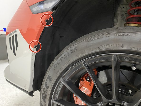 Secure the bumper to the fender liner using the two (2) OEM Phillips head screws removed in step 4. Tighten until snug using a Phillips screwdriver