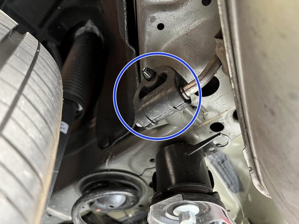 Shown is the driver-side forward muffler hanger, repeat this for the passenger side