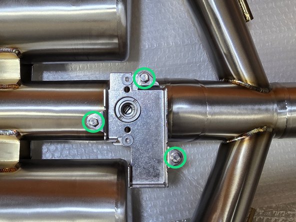 Using your hand, remove the (3) 8mm bolts from the 27Won mounting bracket