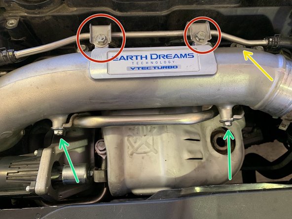 Reinstall the (2) OE 10mm bolts to mount the top hard line to the intake pipe