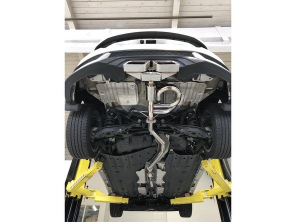 Remove the protective bubble wrap and cardboard from the 27WON exhaust system as shown