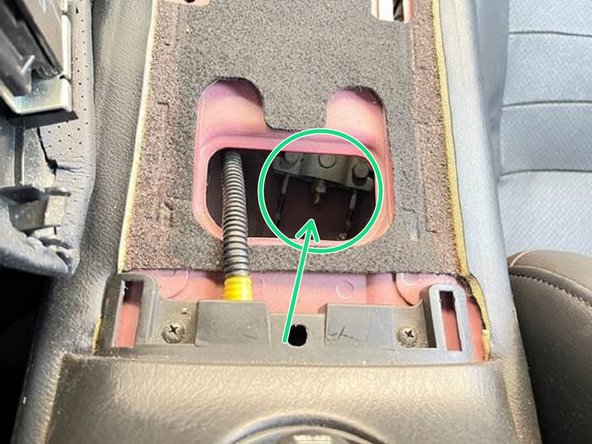 If the cable does not have enough slack to be hooked on, you will have to loosen the parking brake cable nut under the center console