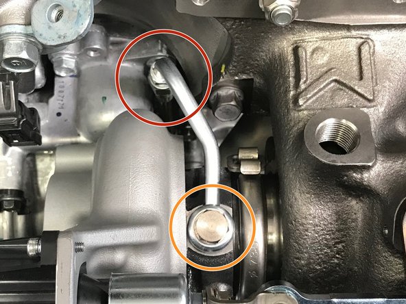 Install the assembled oil feed line onto the turbo.