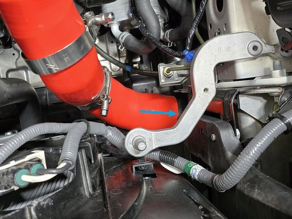 Install the two supplied 63-71mm clamps away from the ends of the silicone as shown