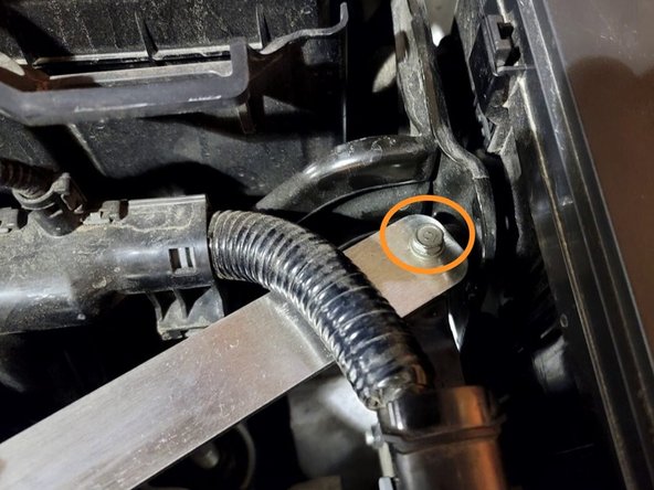 Pull the SRI bracket on top of ECU bracket and finger tighten bolt as shown