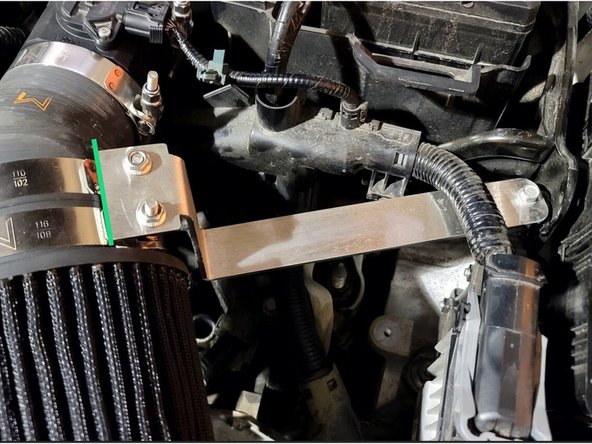 Use provided clamp to securely attach throttle body silicone to MAF housing as shown